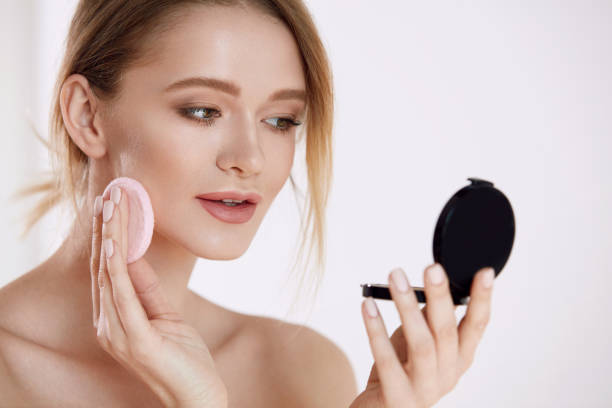 istock Woman Beauty Face. Female Applying Makeup 953929312