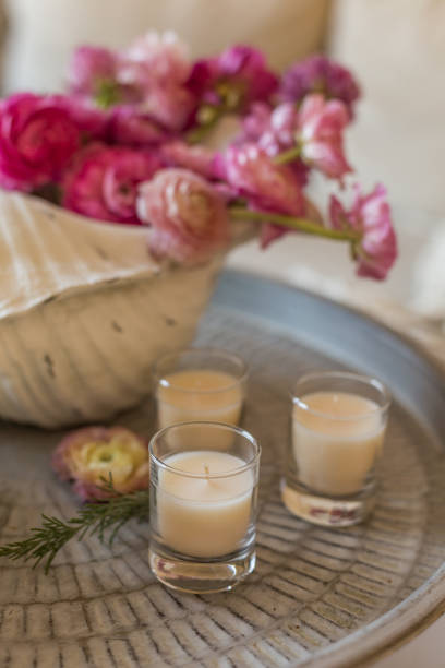 istock White candles on a metal tray 953929954