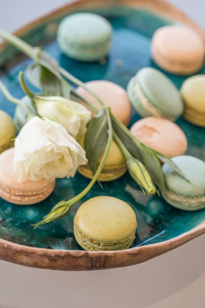 istock Pink and green macaroons and white lisianthus 953933032