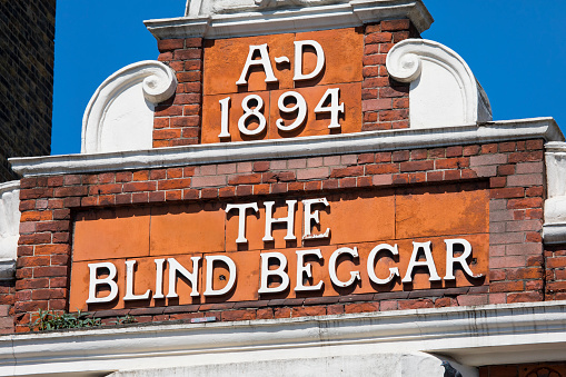 London, UK  - April 19TH 2018: The original lettering on the exterior of The Blind Beggar public house on Whitechapel Road in London, on 18th April 2018. Its known to be the location of the murder of George Cornell by Ronnie Kray.