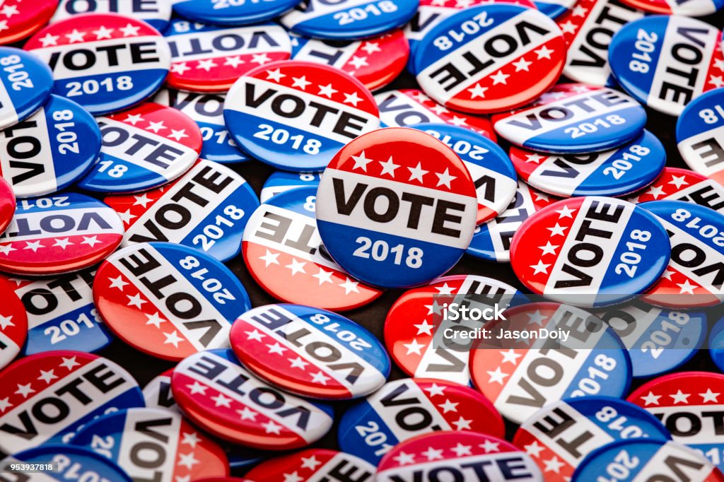 Get Out the Vote High quality stock photo of patriotic voting buttons for the mid term election, some with copy space on white or an American Flag. Voting Stock Photo