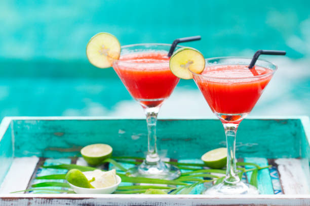 strawberry margarita cocktail on colorful wooden background with palm leaf. copy space. - margarita cocktail beach fruit imagens e fotografias de stock