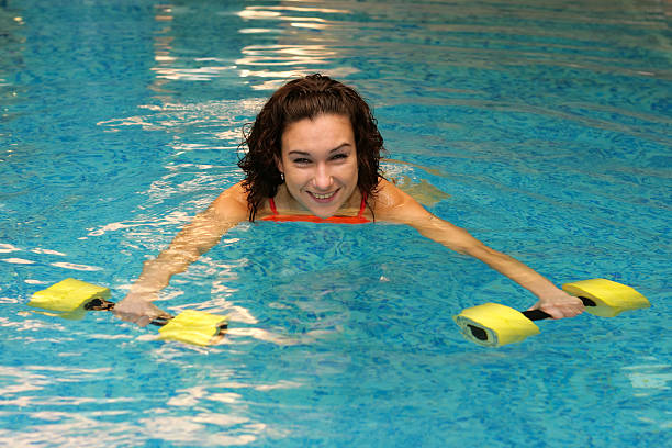 istock women in water with dumbbells 95394910