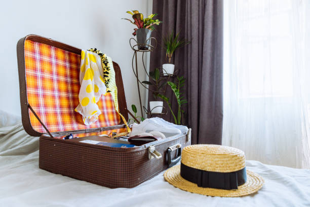 istock suitcase with clothes ready for trip. travel concept. copy space 953951654