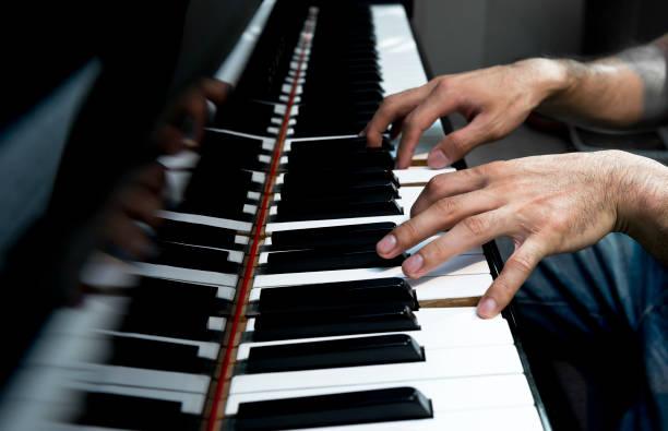 istock A musician plays old grand piano 953952418