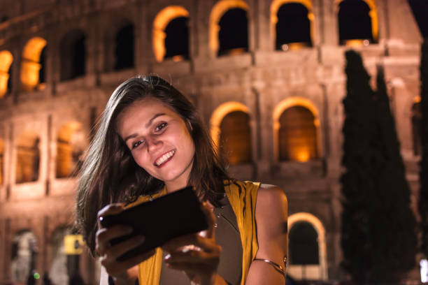 istock Smiling girl with phone 953963272