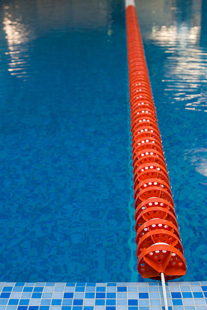 red plastic lane in swimming pool stock photo