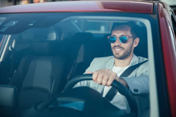 istock Handsome man driving his car 953966338