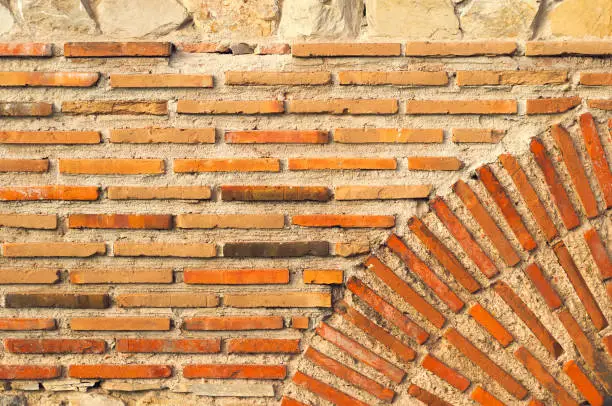 Old brick wall built by ancient citizent. Architectural lines
