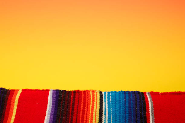 istock Colorful Traditional Mexican Style Blanket On A Yellow Background 953981406