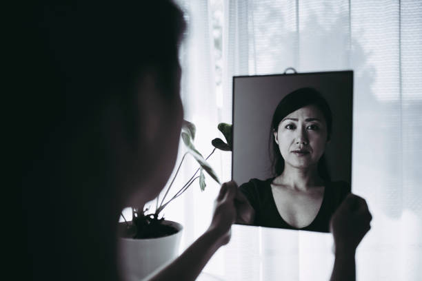 istock woman who is shocked by seeing a mirror 953994292