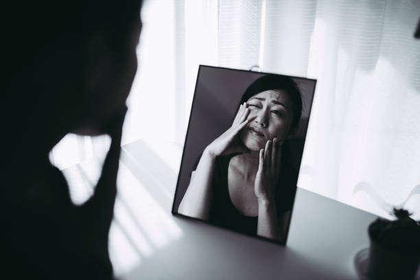 istock woman who is shocked by seeing a mirror 953994320