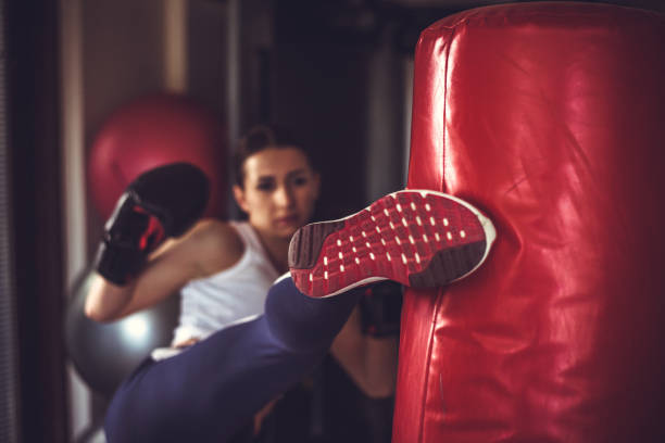 Boxing women women boxing black gloves close up kickboxing stock pictures, royalty-free photos & images