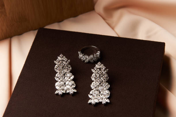 istock Gold jewelry diamond ring and platinum earrings 954003164