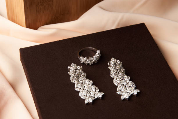 istock Gold jewelry diamond ring and platinum earrings 954003386