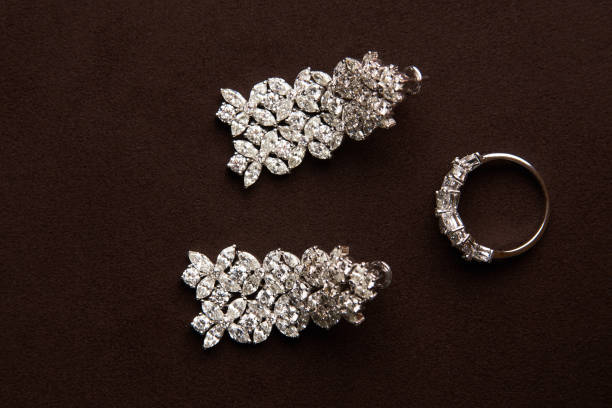 istock Gold jewelry diamond ring and platinum earrings 954003774