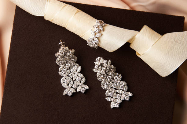istock Gold jewelry diamond ring and platinum earrings 954004028