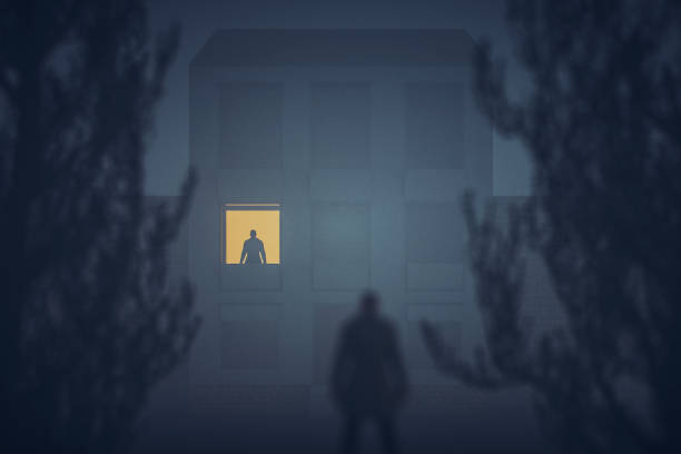 istock Sinister looking stalker watching the house 954004098