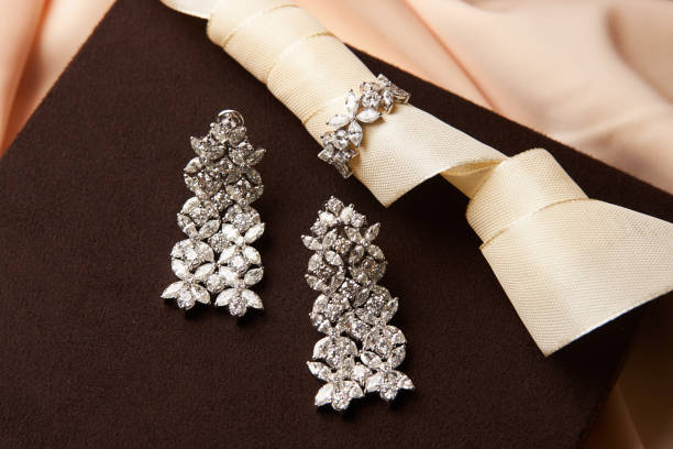 istock Gold jewelry diamond ring and platinum earrings 954004174
