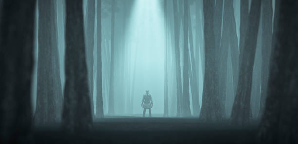 istock Spooky man in trench coat standing in the forest 954004504