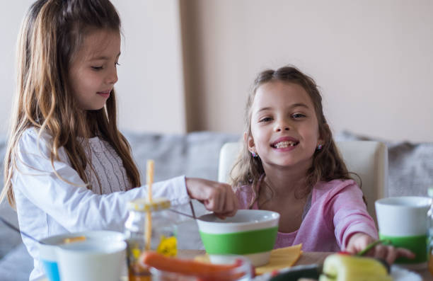 istock Girls at the kitchen table 954007344
