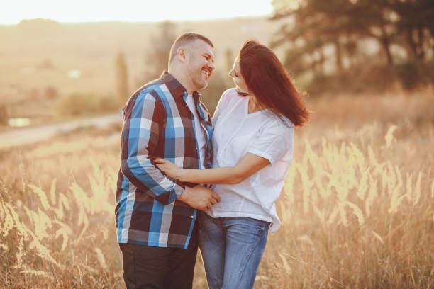 istock loving couple in a park 954008616
