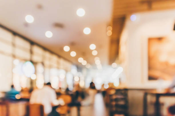 istock Restaurant cafe or coffee shop interior with people abstract defocused blur background 954012336