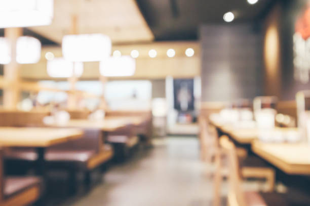 istock abstract blurred cafe restaurant with bokeh lights defocused background 954012350