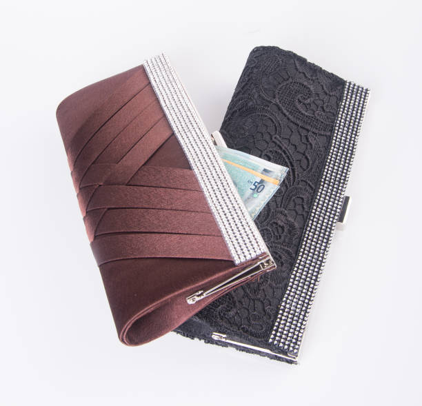 istock wallet. woman wallet with money on background 954018746
