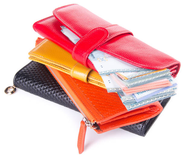 istock wallet. woman wallet with money on background 954018874