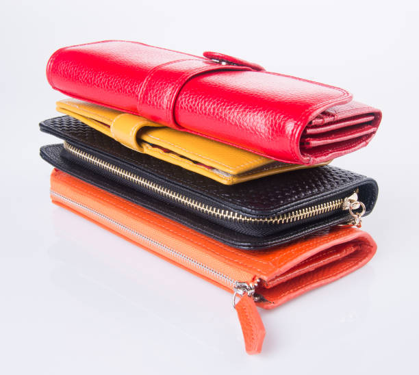 istock wallet. woman wallet on background 954018912