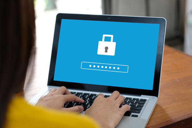 istock Hand tying laptop computer with password login on screen, cyber security concept 954039442