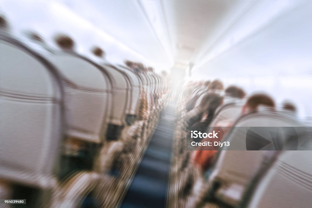 plane shakes during turbulence flying through the air hole. aerophobias concept. plane shakes during turbulence flying air hole. Blur image commercial plane moving fast downwards. Fear of flying. collapse slump, depression, downfall, debacle, subsidence, trip. Airplane Stock Photo