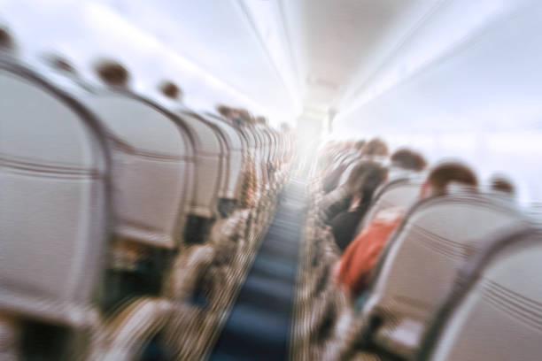plane shakes during turbulence flying through the air hole. aerophobias concept. plane shakes during turbulence flying air hole. Blur image commercial plane moving fast downwards. Fear of flying. collapse slump, depression, downfall, debacle, subsidence, trip. airplane crash photos stock pictures, royalty-free photos & images