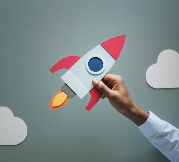 istock Hand holding rocketship startup business 954050330