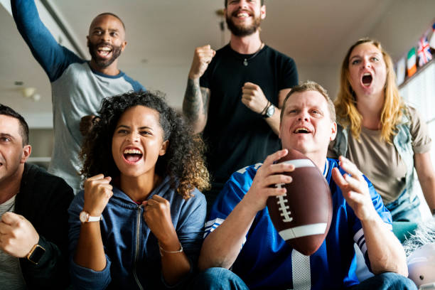 istock Friends cheering sport league together 954050818