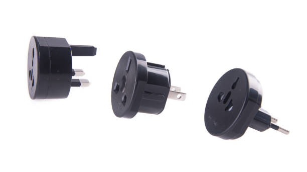 istock Travel plug adapter on the background 954052360