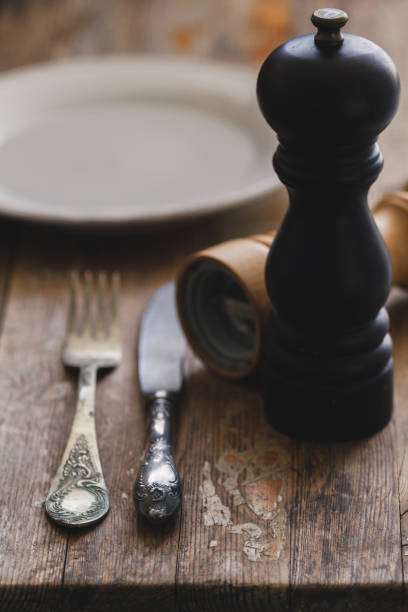 istock Vintage silverware or cutlery on a wood rustic table background. 954055806