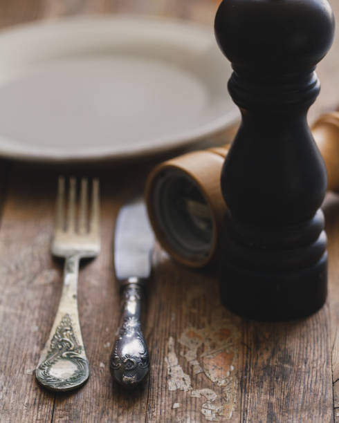istock Vintage silverware or cutlery on a wood rustic table background. 954055814