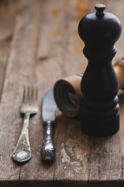 istock Vintage silverware or cutlery on a wood rustic table background. 954055824