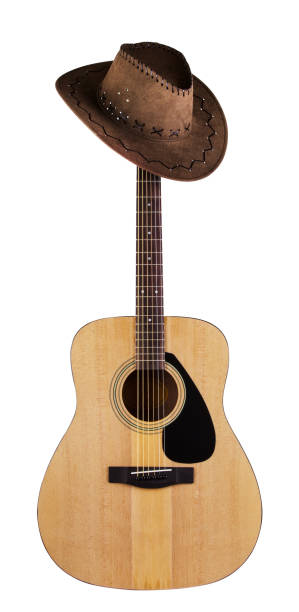istock Acoustic guitar with hanging hat on fingerboard 954056074