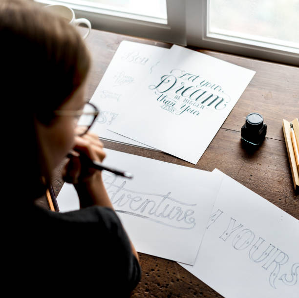 istock Closeup of a calligrapher working on a project 954061460