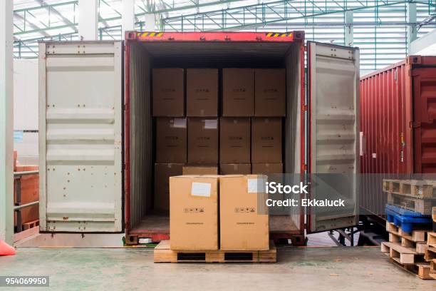 The Cartons With Loading Out Of Container Stock Photo - Download Image Now - Container, Unloading, Truck