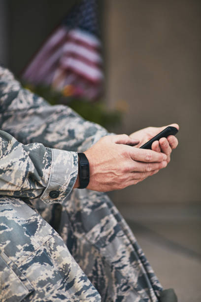 istock Military service member checking data on phone from fitness tracker 954070038