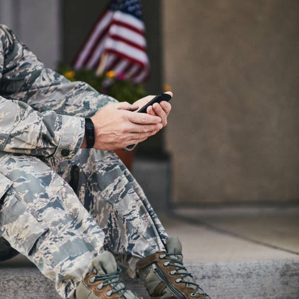 istock Military service member checking data on phone from fitness tracker 954070048