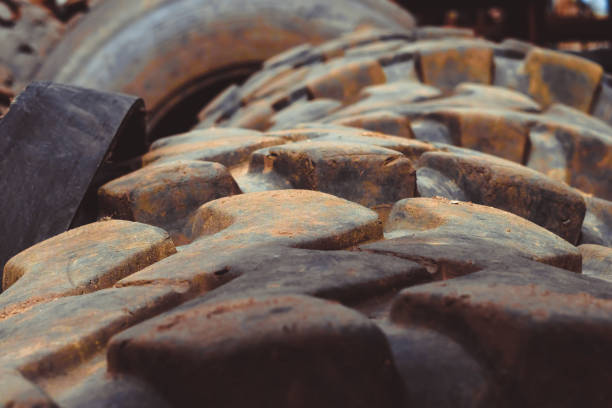 old truck tires lie in the landfill, worn and dirty