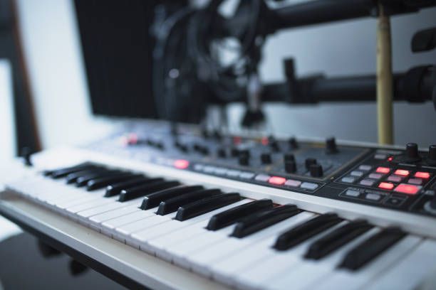 istock Close-up of piano keyboard in recording studio 954074420