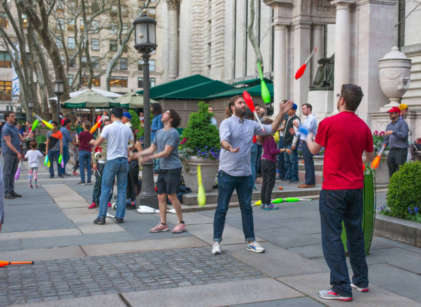 Jugglers and Spinners Practicing at Bryant Park on a Spring Evening stock photo