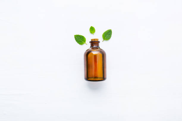 istock Essentail oil with fresh mint leaves. 954074798