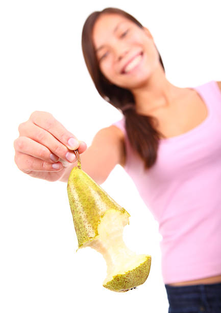 red pear in hand path isolated on white